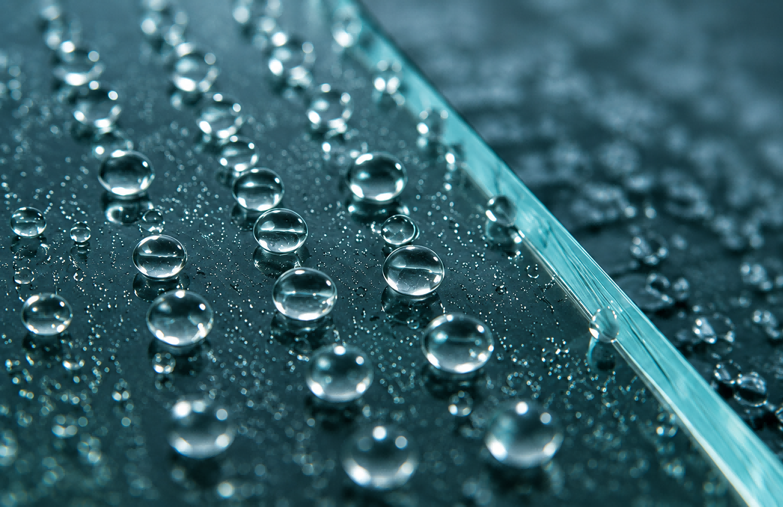 Hydrophilic (self-cleaning) coating sheets the water evenly across the surface, flushing away dust and environmental debris from the fixture.